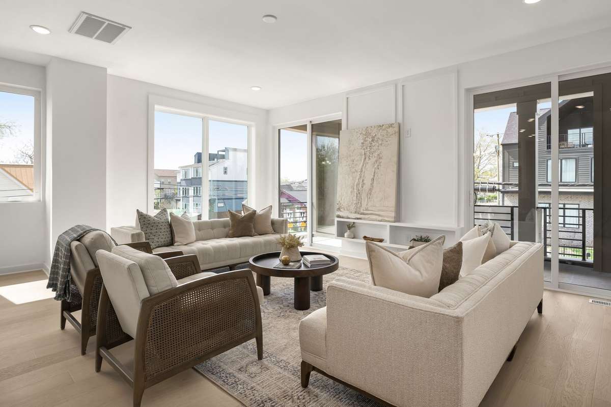 Spacious living room with balcony for indoor/outdoor entertaining