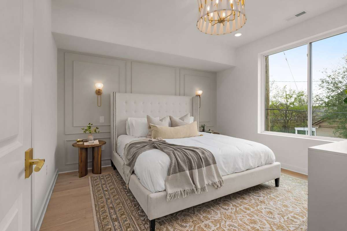 Primary bedroom with wall molding details