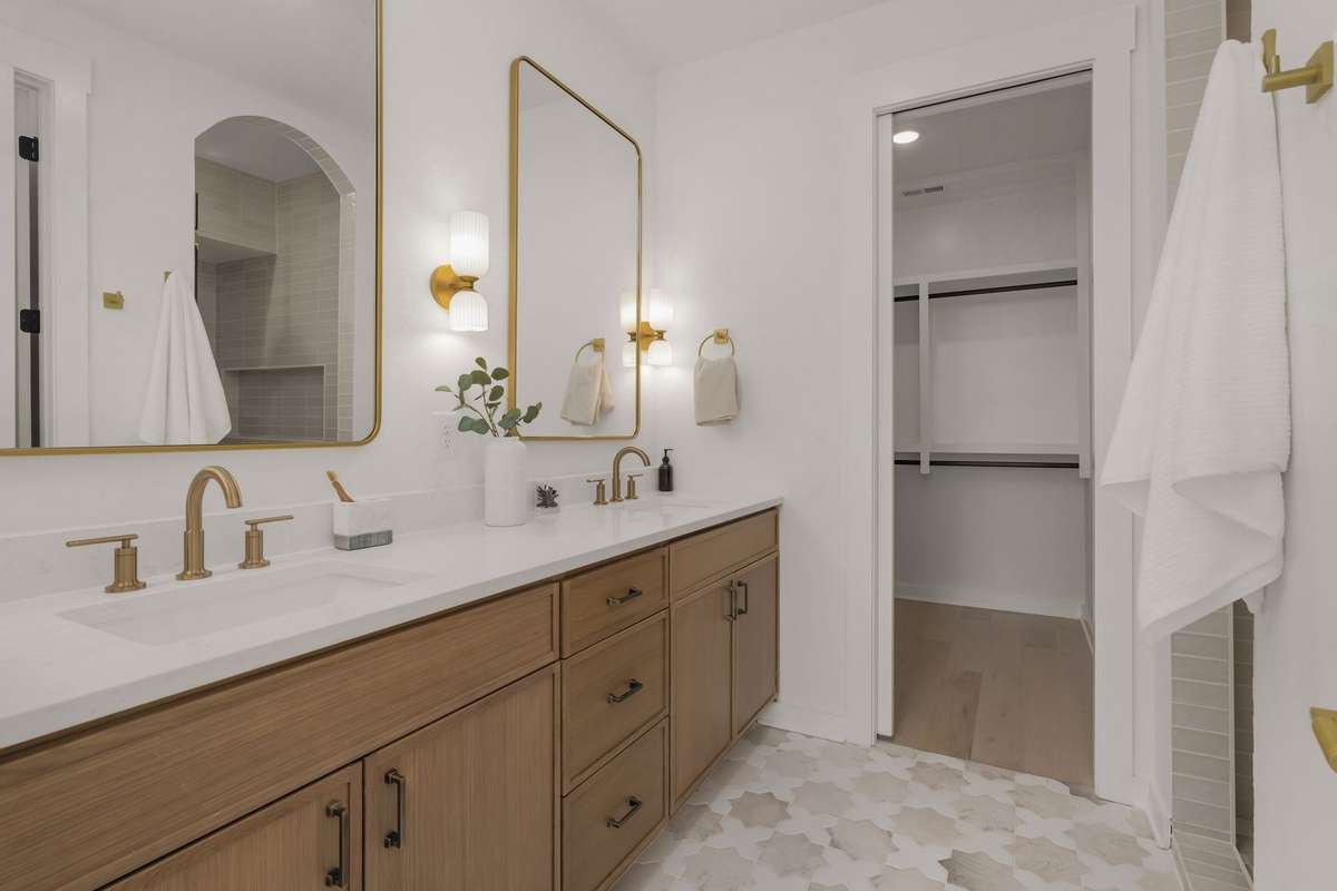 Primary bathroom with dual vanities