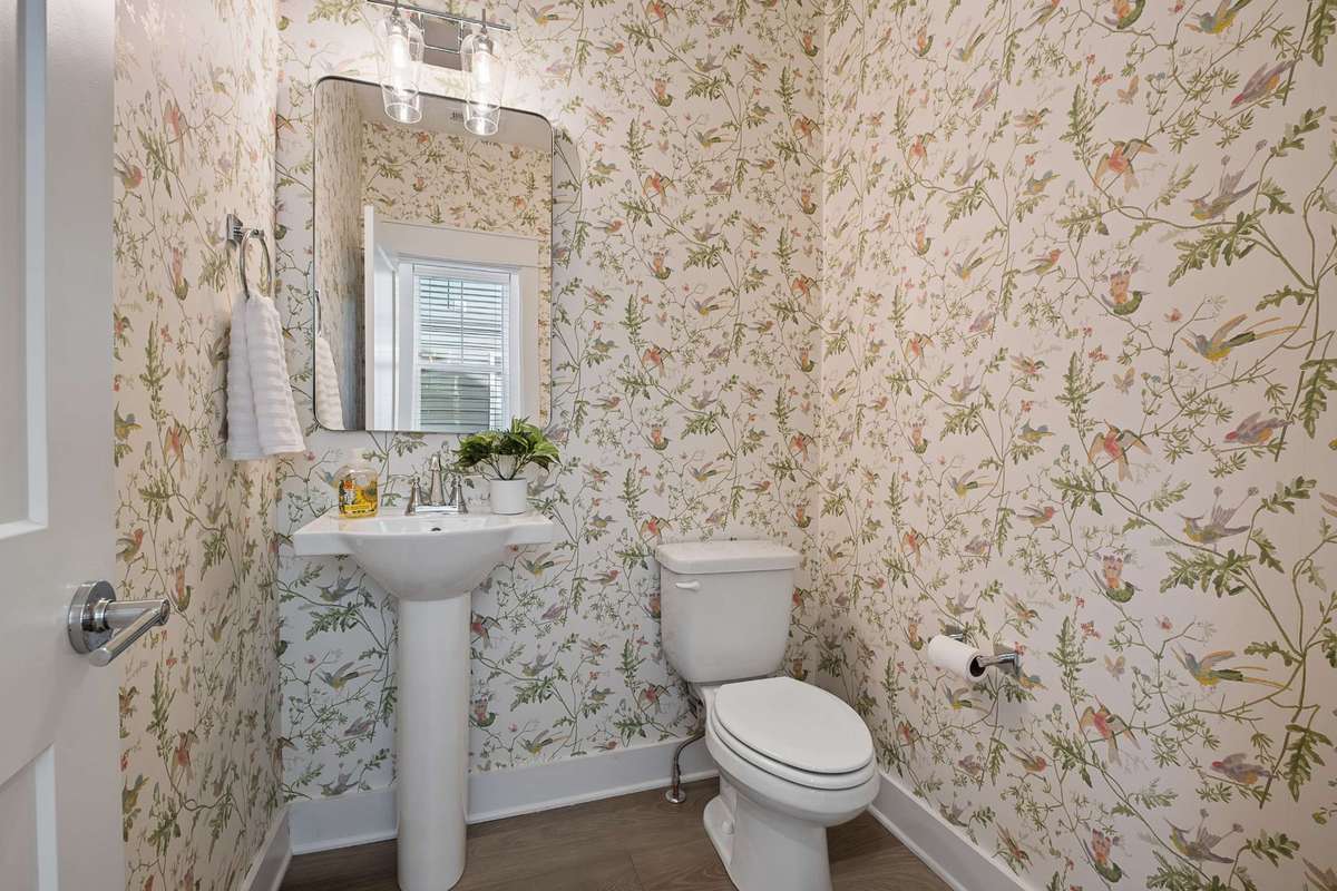 Main level powder room just off of kitchen