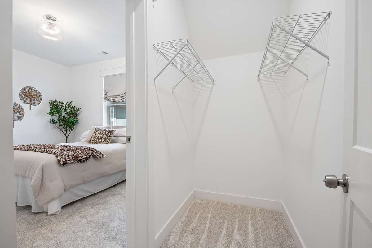 Walk-in closet flows into unfinished attic space