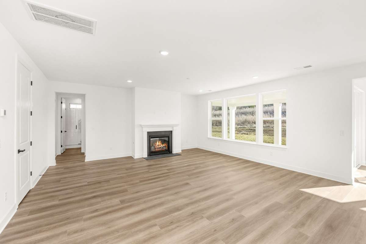 Gas fireplace situated perfectly in the middle of your massive living room. Tons of natural light!