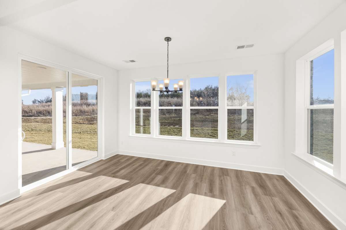 Sunroom, dining area leading to your rear covered patio!