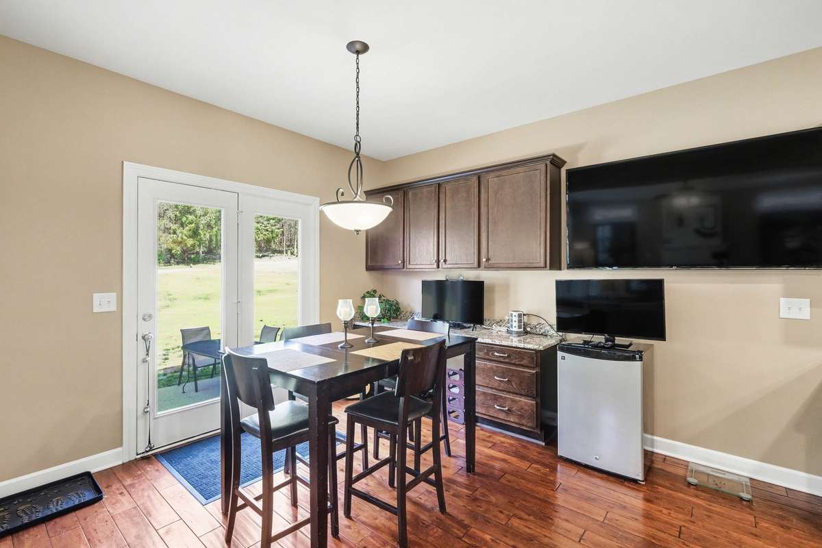 Imagine getting your work done on this impressive seven-foot granite workstation in the breakfast area—perfectly blending productivity and everyday living. Bright and inviting, this space features ample cabinetry, and easy access to the outdoor patio