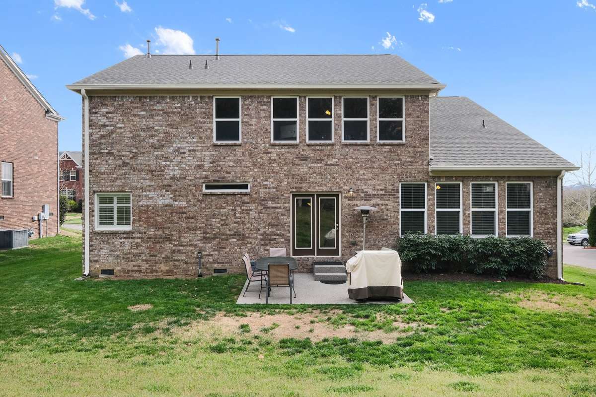 Beautiful brick exterior with a private backyard setting, featuring a patio ideal for outdoor dining and entertaining. Enjoy a generous yard with plenty of space to relax, play, or create your own outdoor oasis.
