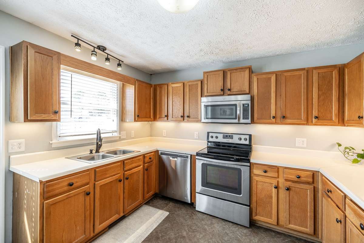 Kitchen has LOADS of natural light, counter space and cabinets!