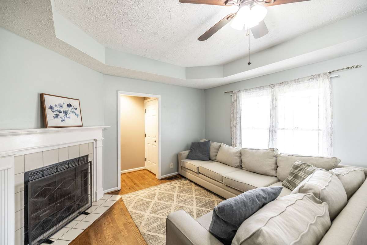 Lots of bright light in the den with fireplace and trey ceiling