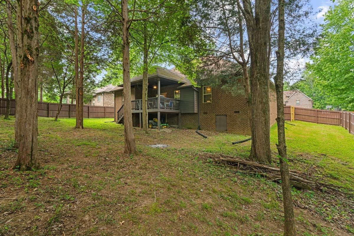 Big backyard with storage area under the deck.