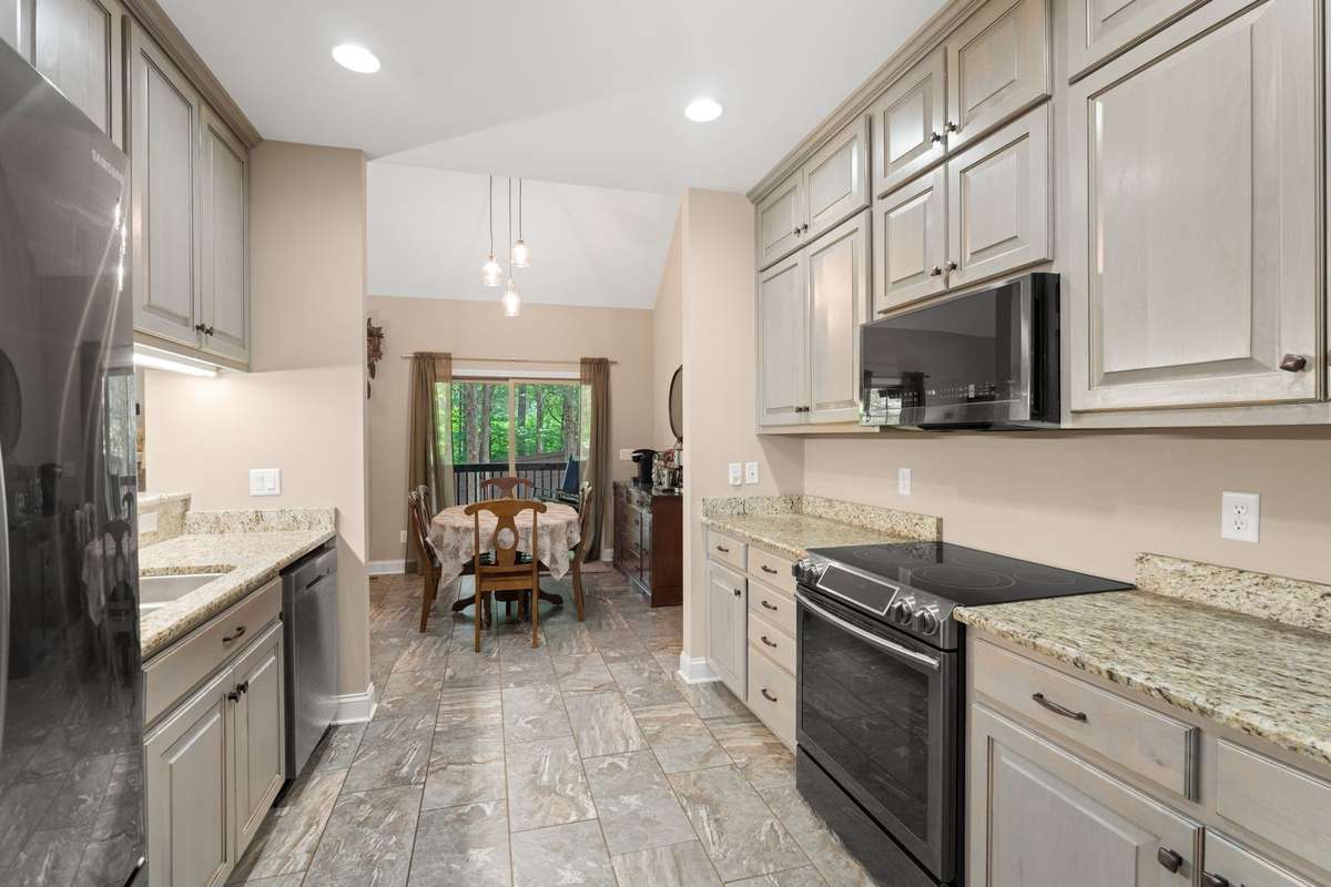Kitchen with upgraded granite counter tops and custom Adler cabinets.
