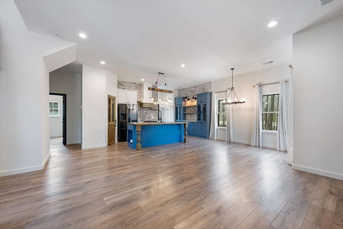 Front door view to main living area and kitchen. Open layout