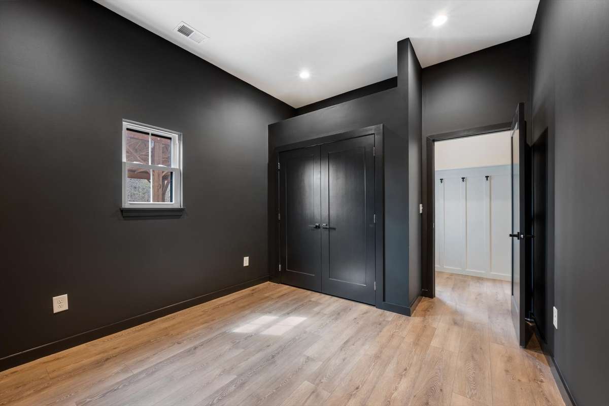 Downstairs bedroom by back door. Could be used as an office area as well.