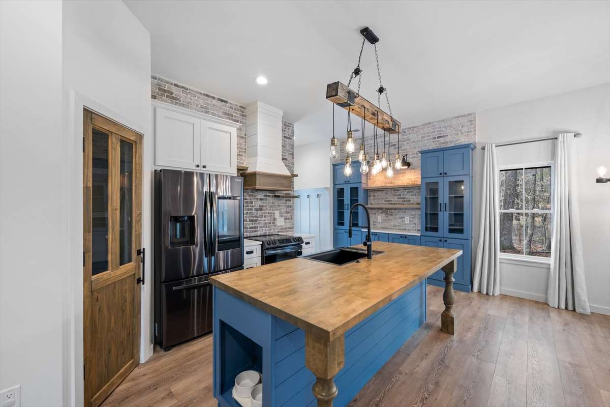 Kitchen and beautiful pantry door and built in pet feeding area