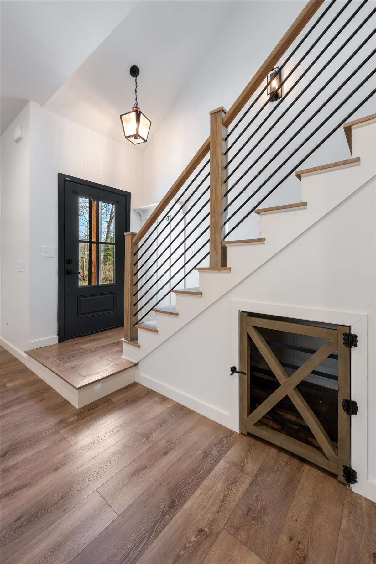 Stairs with built in dog kennel, or could be extra storage space