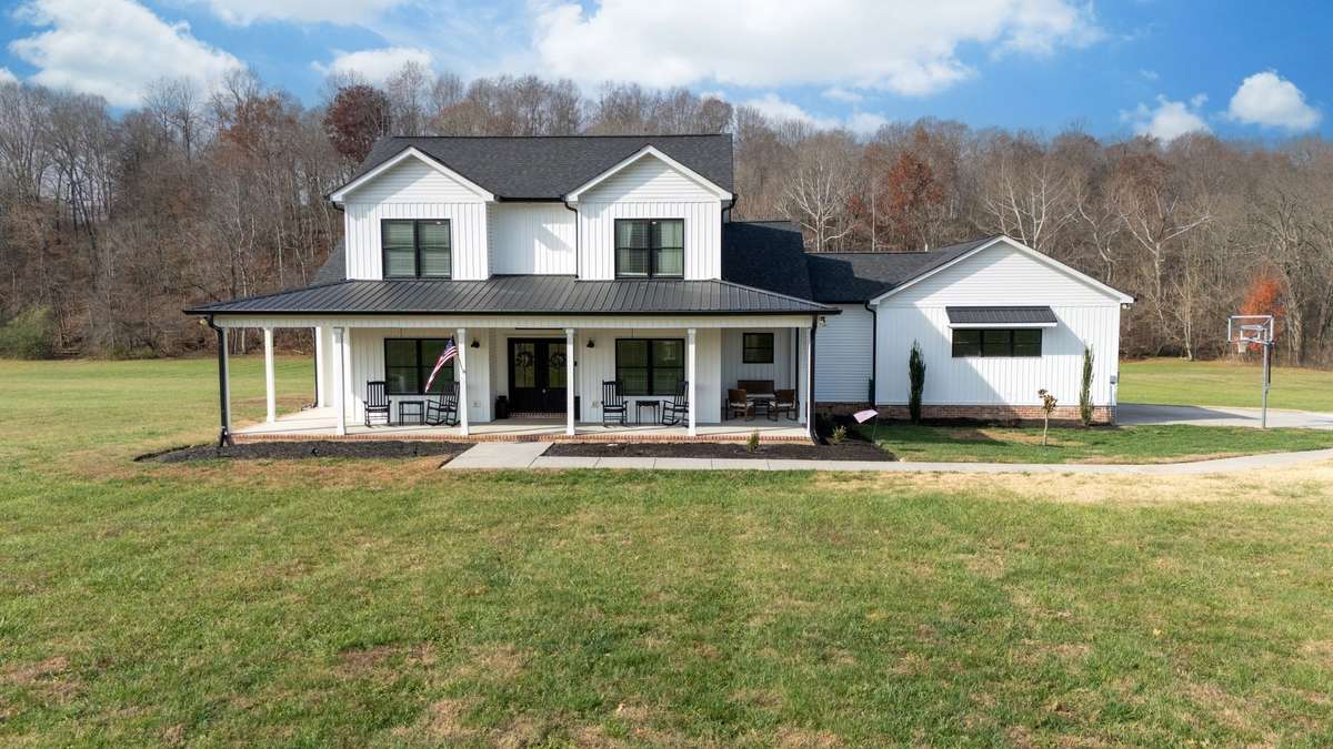 GORGEOUS 2 Story Home w/ 
Long Covered Front + Back Porches