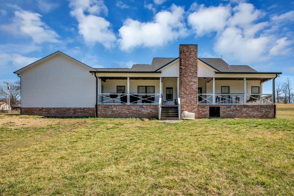 FABULOUS Back Porch w/ Outdoor Fireplace + Bar Area
5.62 Acres+/-