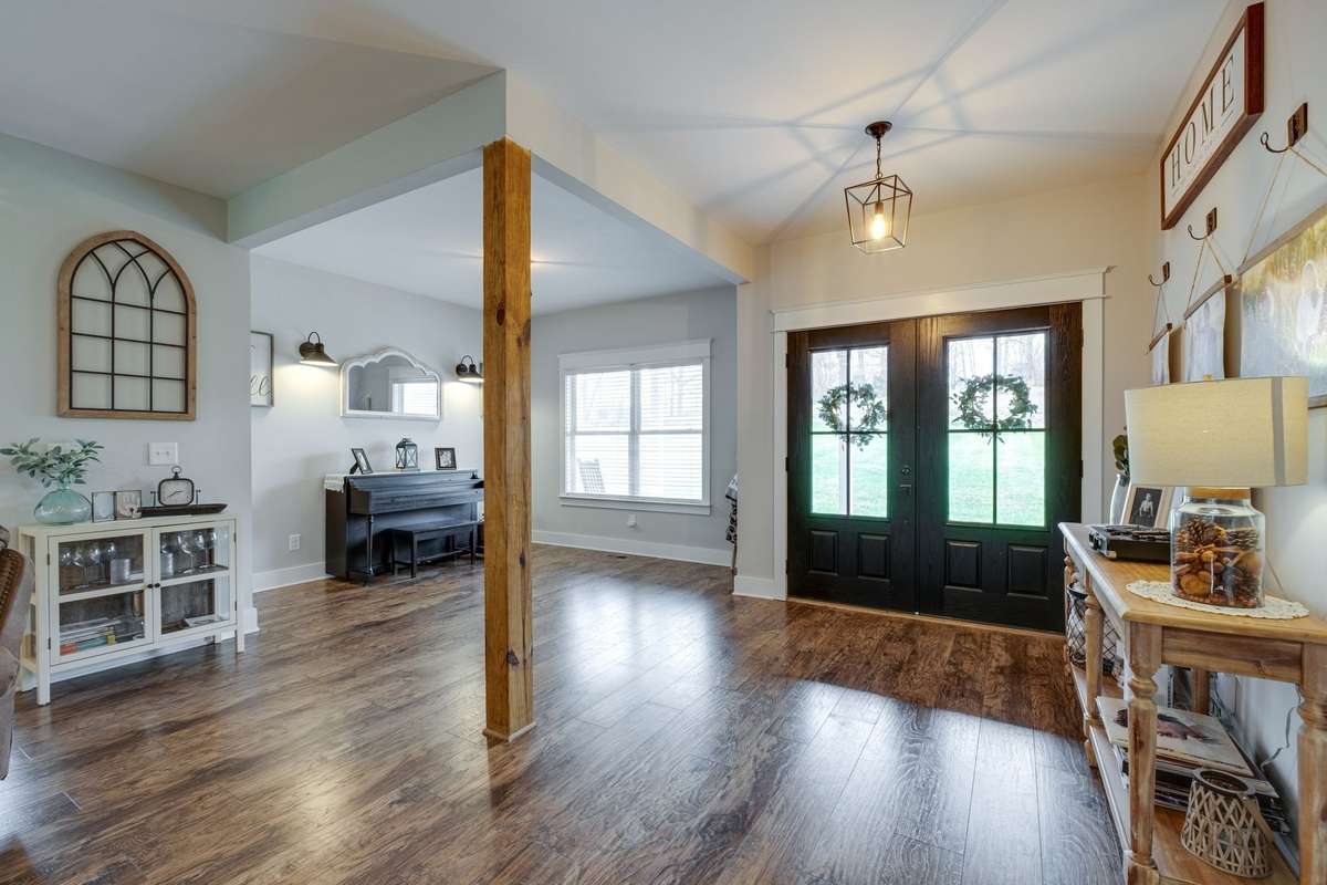 UPGRADED Wide Plank Flooring in Main Living Areas 
Engineered Wood) 
Tile in Bathrooms