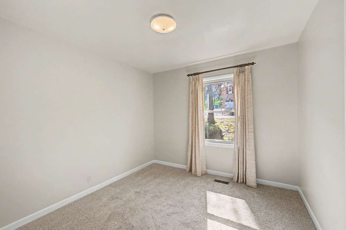 Bedroom off the hall and across from the bathroom. New carpet and paint!
