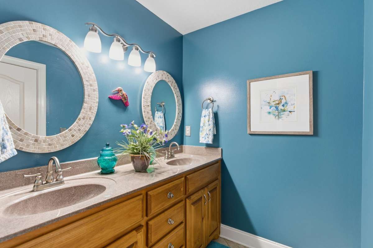 Large full bath located upstairs with double vanity