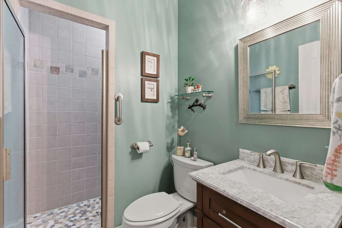 Full bath with walk-in shower located on main level.
