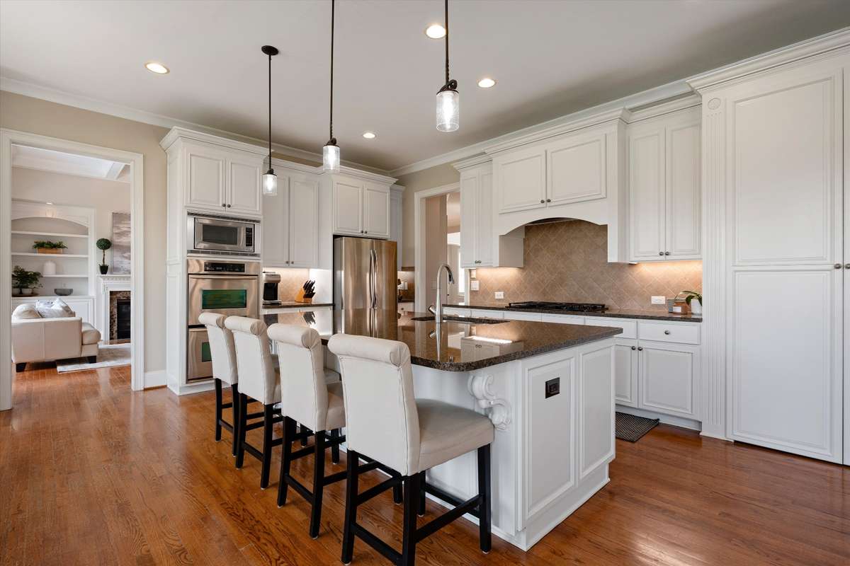 Enjoy island seating, with storage underneath--note the large pantry to the right