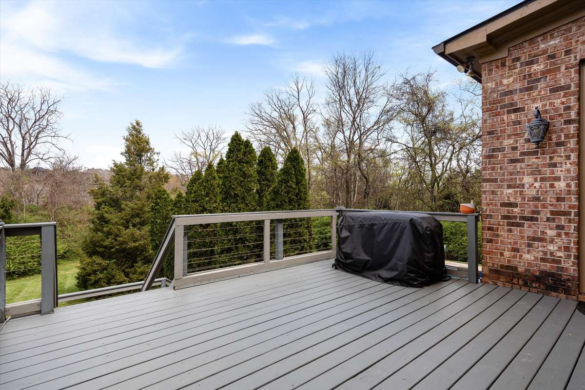 Enjoy the view from the upper deck. Recently painted, it's a great space to grill as it's just off the kitchen