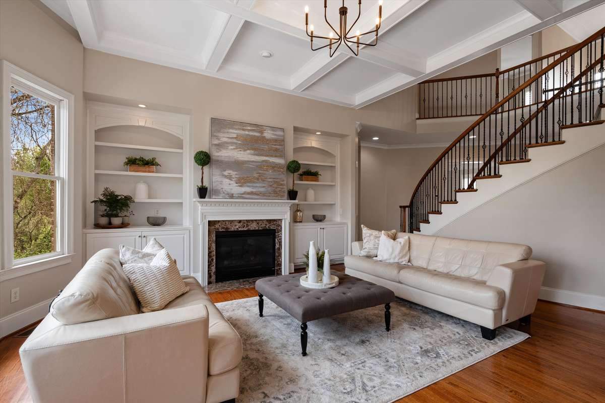 So much detail in this space--built in's, coffered ceiling, new lighting and a gas log fireplace