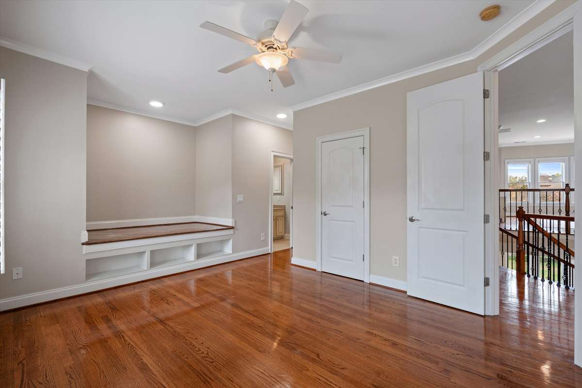 Upstairs bedroom with built in storage and cut out for bedding---great spot for a day bed with pillows, a tent type bed or canopy. Double closet and en suite bath