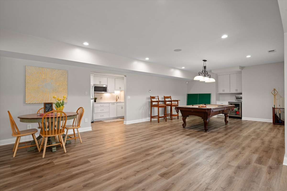 Space for a table to eat, play cards, etc. The basement can be a "fun zone" or living/guests quarters