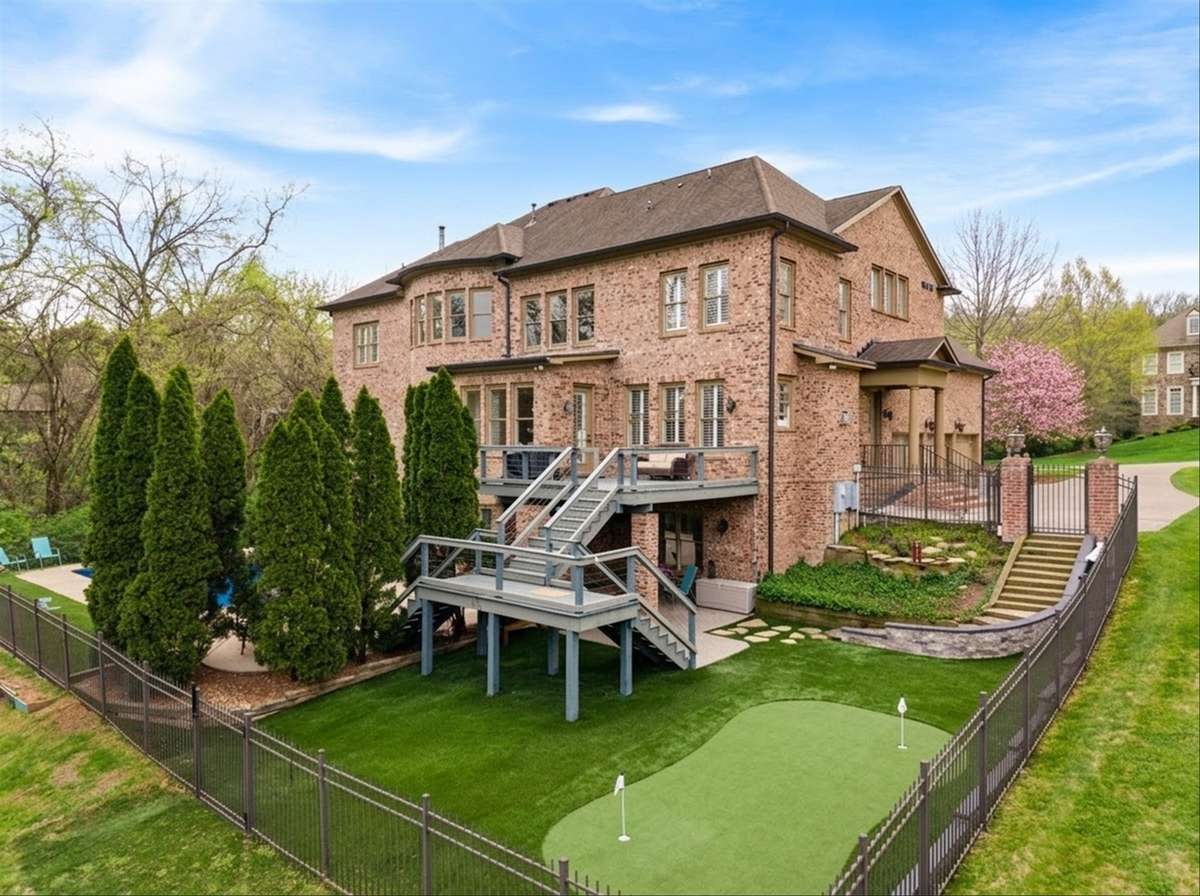*virtually staged* You'll enjoy a fully fenced backyard with low maintenance astroturf. It's the perfect spot to add a little putting green and still have room for a swingset