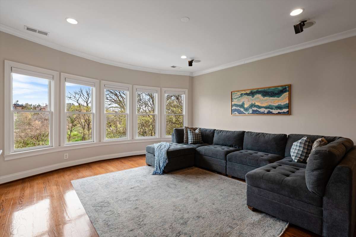 Upstairs you will enjoy a gathering area with an expansive wall of windows