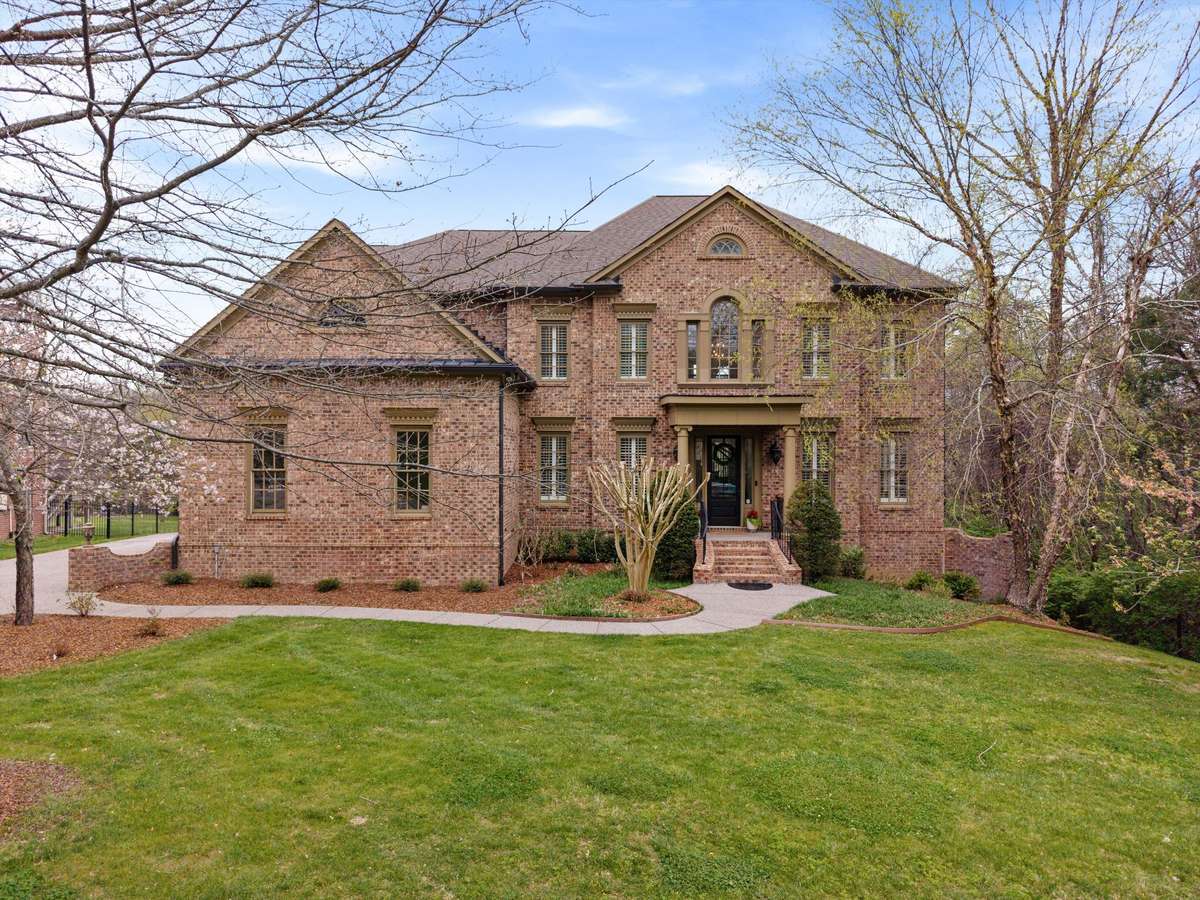 Located in a lovely cul de sac this luxury estate is surrounded by trees and common space in back. You'll enjoy fresh front landscape and a beautiful, new front door