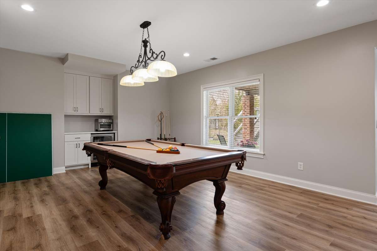 Be the home all the neighborhood kids want to hang out at with a pool table and dry bar in the walk out basement