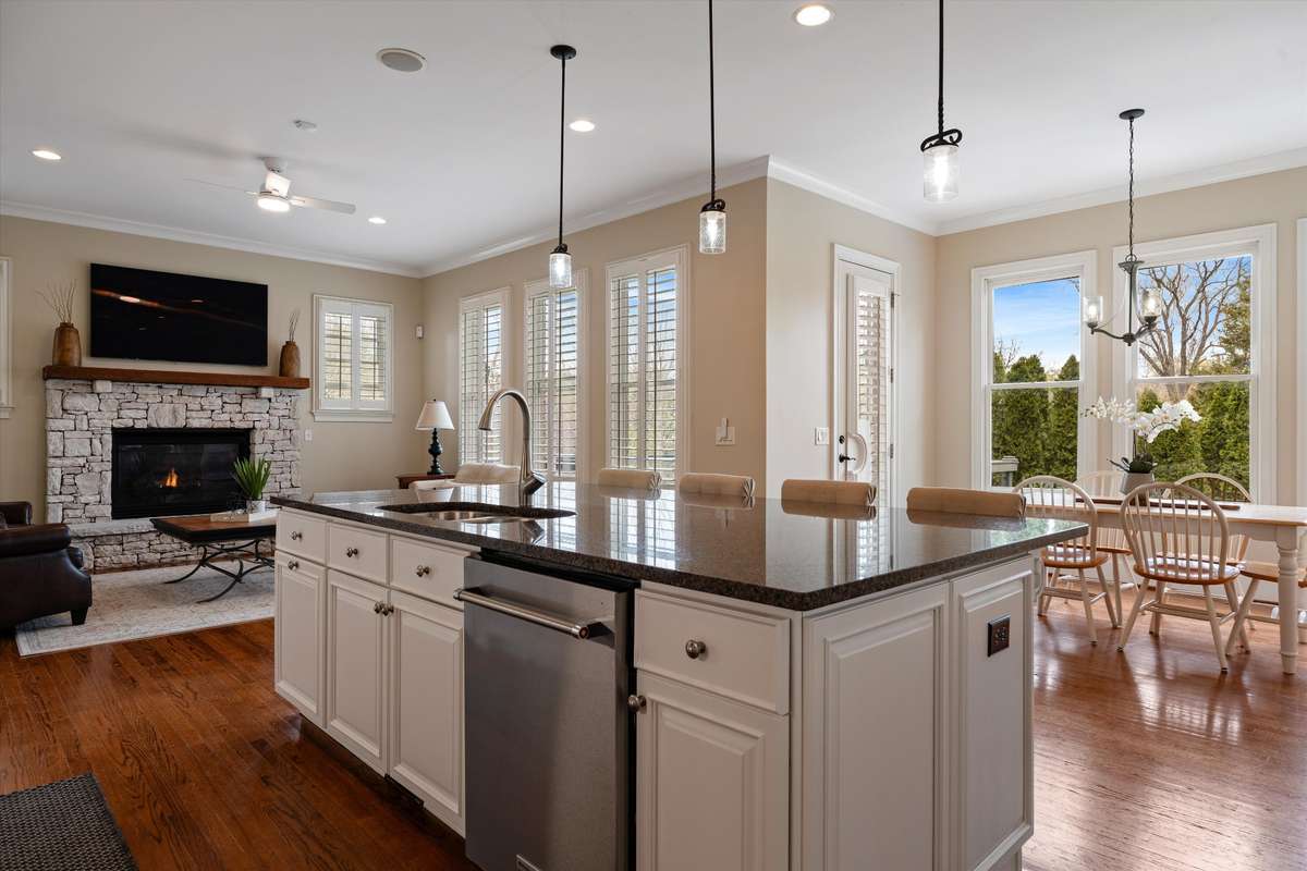Prep meals at the kitchen island while chatting with guests. The open concept space in the eating area allows for seamless entertaining and seating options