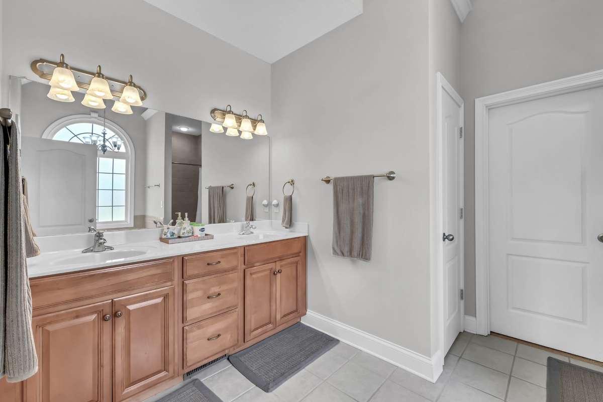 Primary Bathroom Features an Oversized Double Vanity, Toilet Closet & Huge Walk-in Closet!
