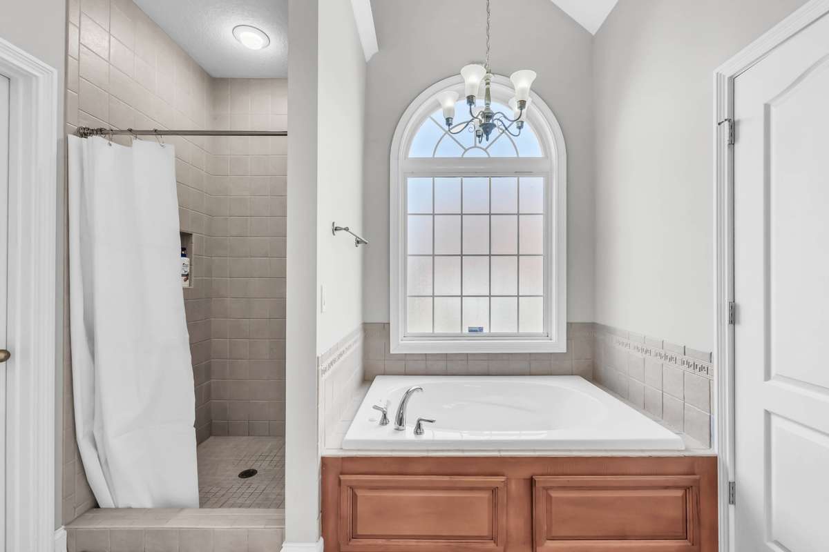 Large Tub w/ a Frosted Window & a Separate Tile Shower!