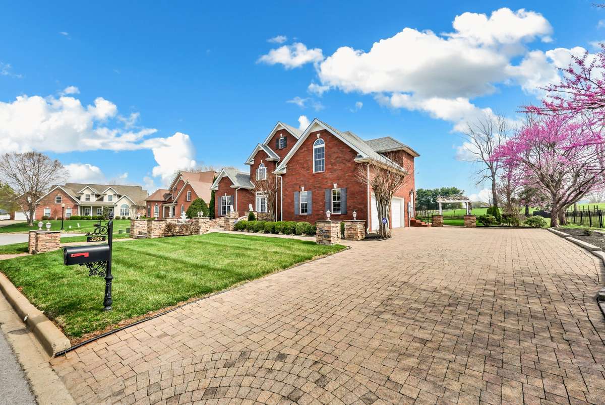 All Brick, Side Load Garage & a Stone Driveway!