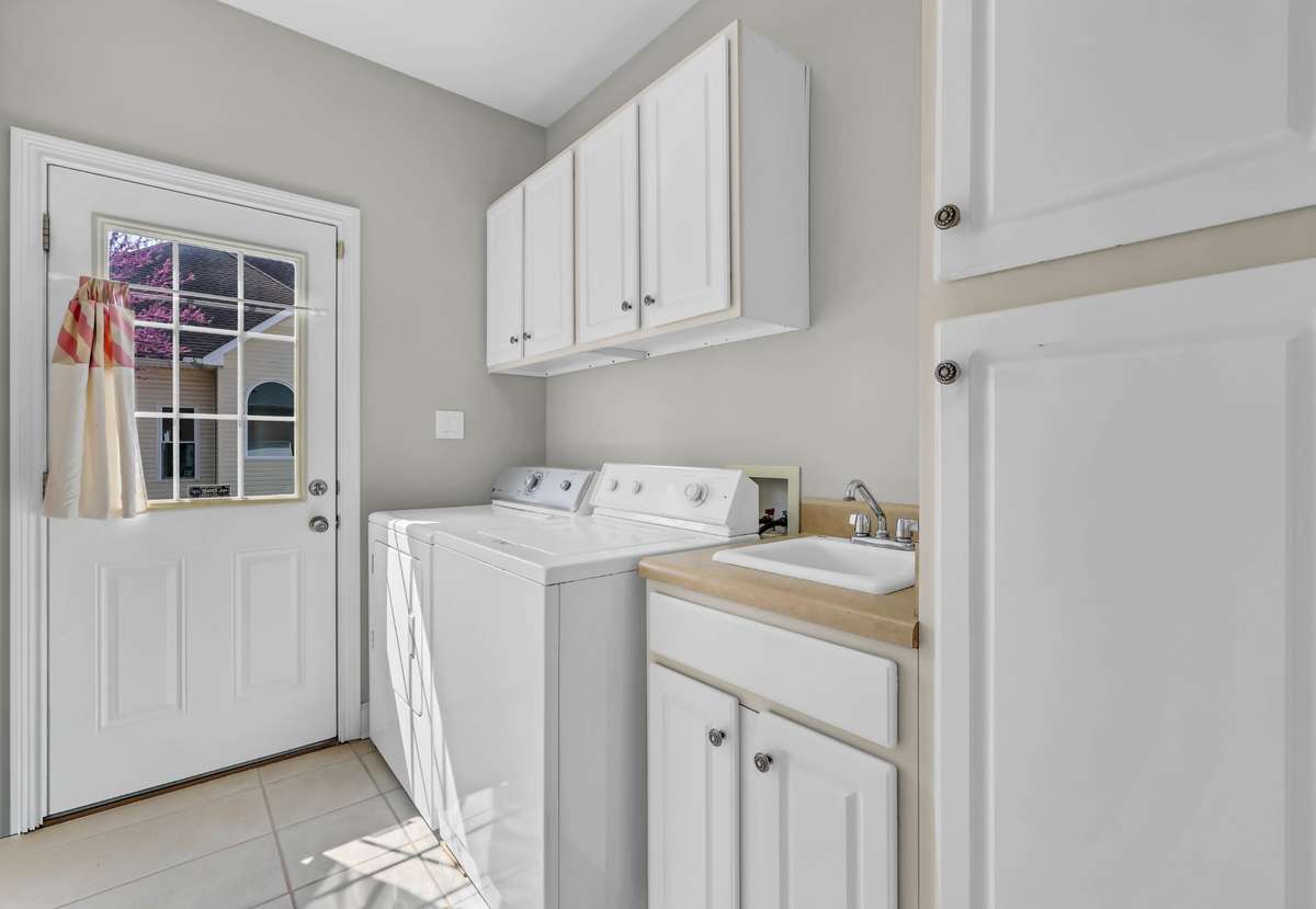 Laundry/Mud Room w/ Tile Flooring, Laundry Sink, Cabinets, Access to Outside & Washer & Dryer Convey!
