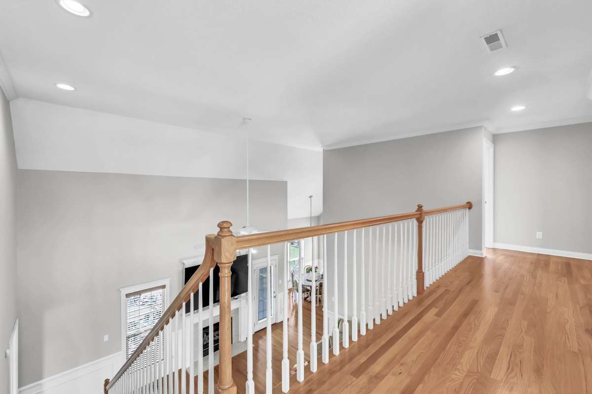 Spacious Hallway Upstairs w/ Harwood Flooring & Views of the Living Room on 1 Side & Foyer on the Other!