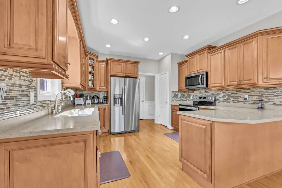 Spacious Kitchen w/ Corian Countertops, Recessed Lighting & Lots of Cabinetry!