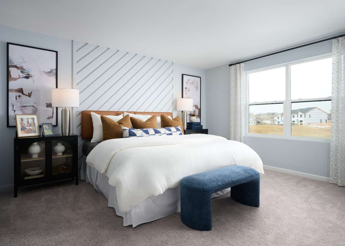Owner's retreat is oversized. King bed pictured. Photo of our furnished model home - colors may vary, see sales for specifics