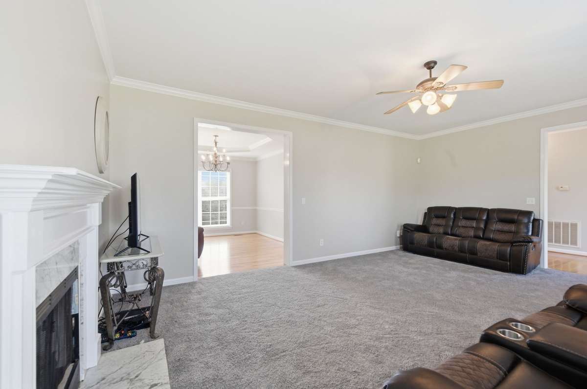 Open-concept layout connects the living room to the formal dining area, creating an ideal flow for everyday living and entertaining.
