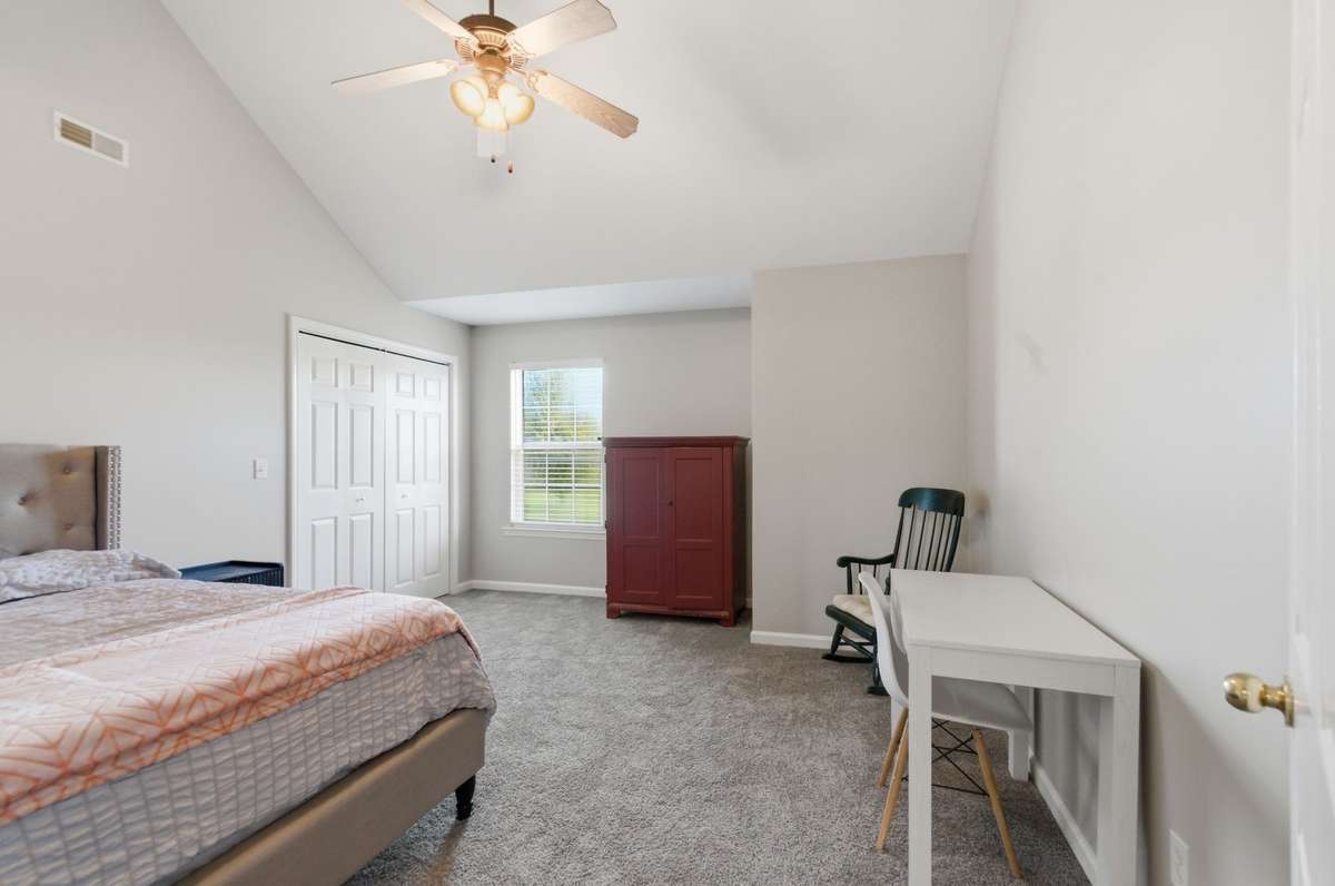 Vaulted ceiling enhances the sense of space, with ample room for furnishings and a functional layout.