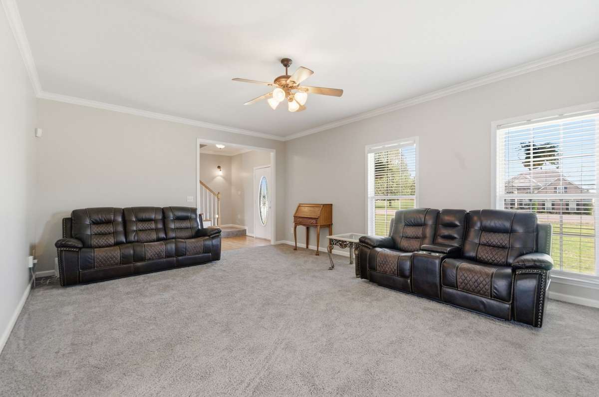 Generous living space ideal for gatherings, with easy flow back toward the foyer and adjacent rooms.