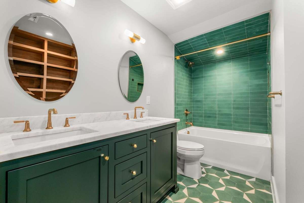 upstairs full bath #3, with designer tile selections, dual sinks, and tub / shower combo.