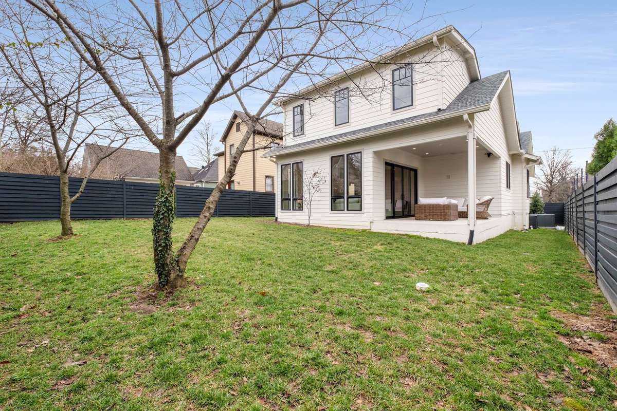 View of back addition of the home, and yard space