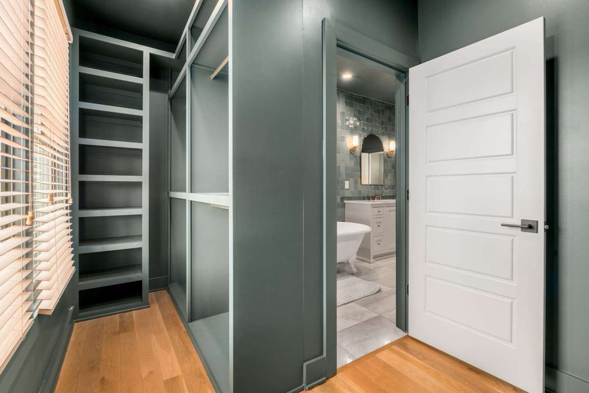 Alternate view of primary bedroom closet.   All window blinds convey.