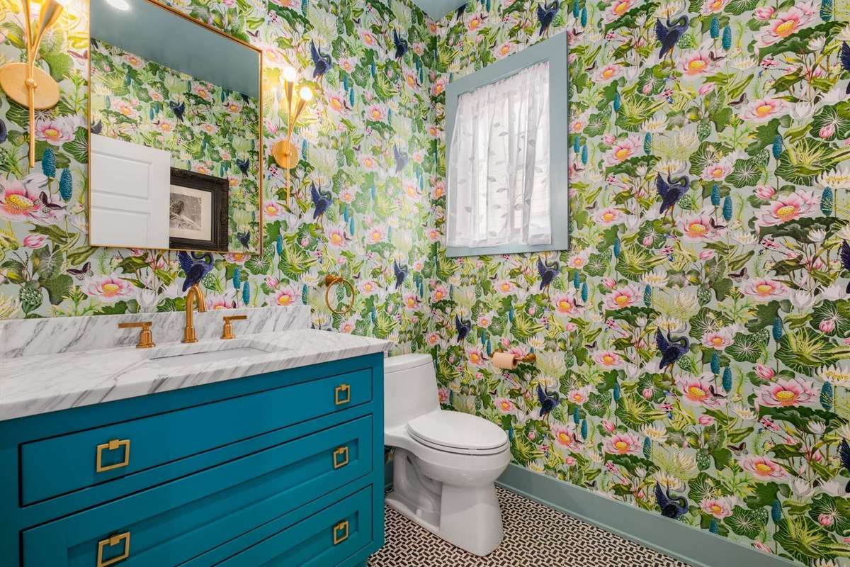Powder bath on first floor, features designer tiles, wall covering, lighting and more.  All mirrors convey.