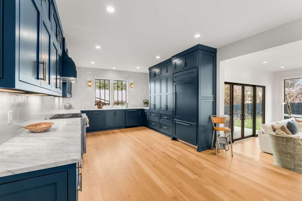 Alternate view of kitchen setup, with access into oversized living room and outdoor entertaining area
