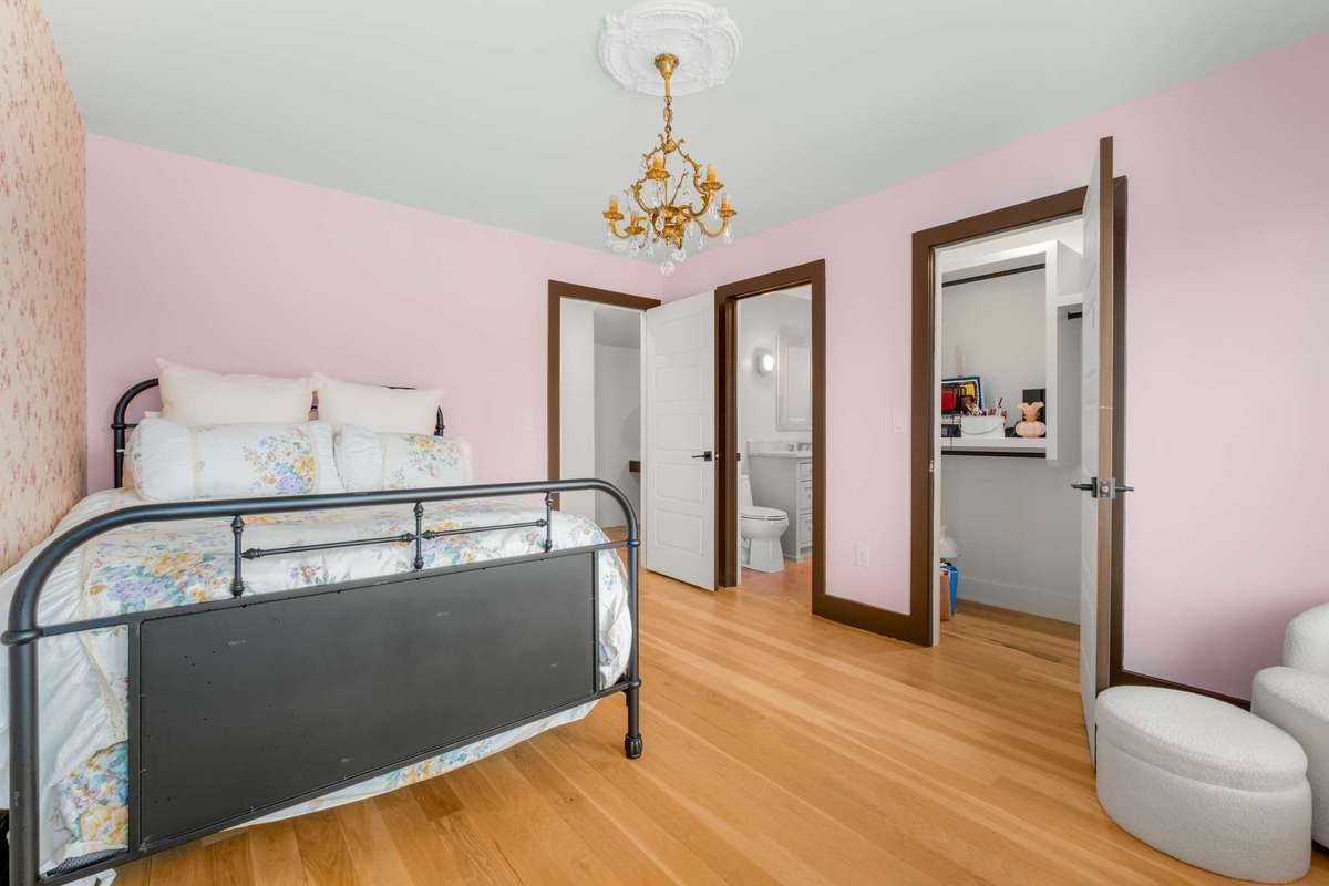 Alternate view of secondary bedroom upstairs with access to bath, walk in closet, and upstairs common living space
