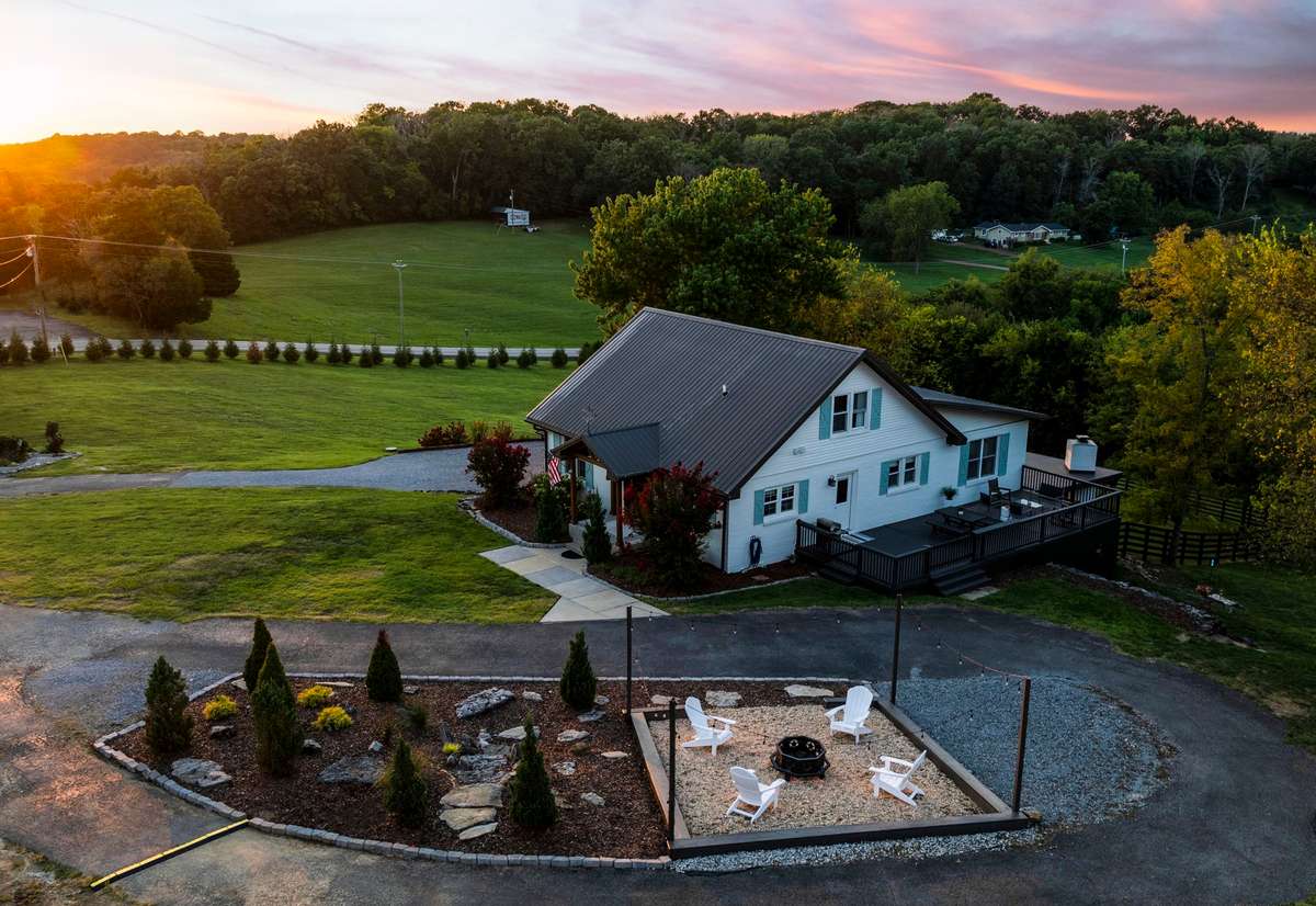 From the moment you arrive, the property welcomes you with sweeping views, mature landscaping, and a sense of calm that feels far from the everyday, yet is just minutes from shopping, dining, and modern conveniences.
